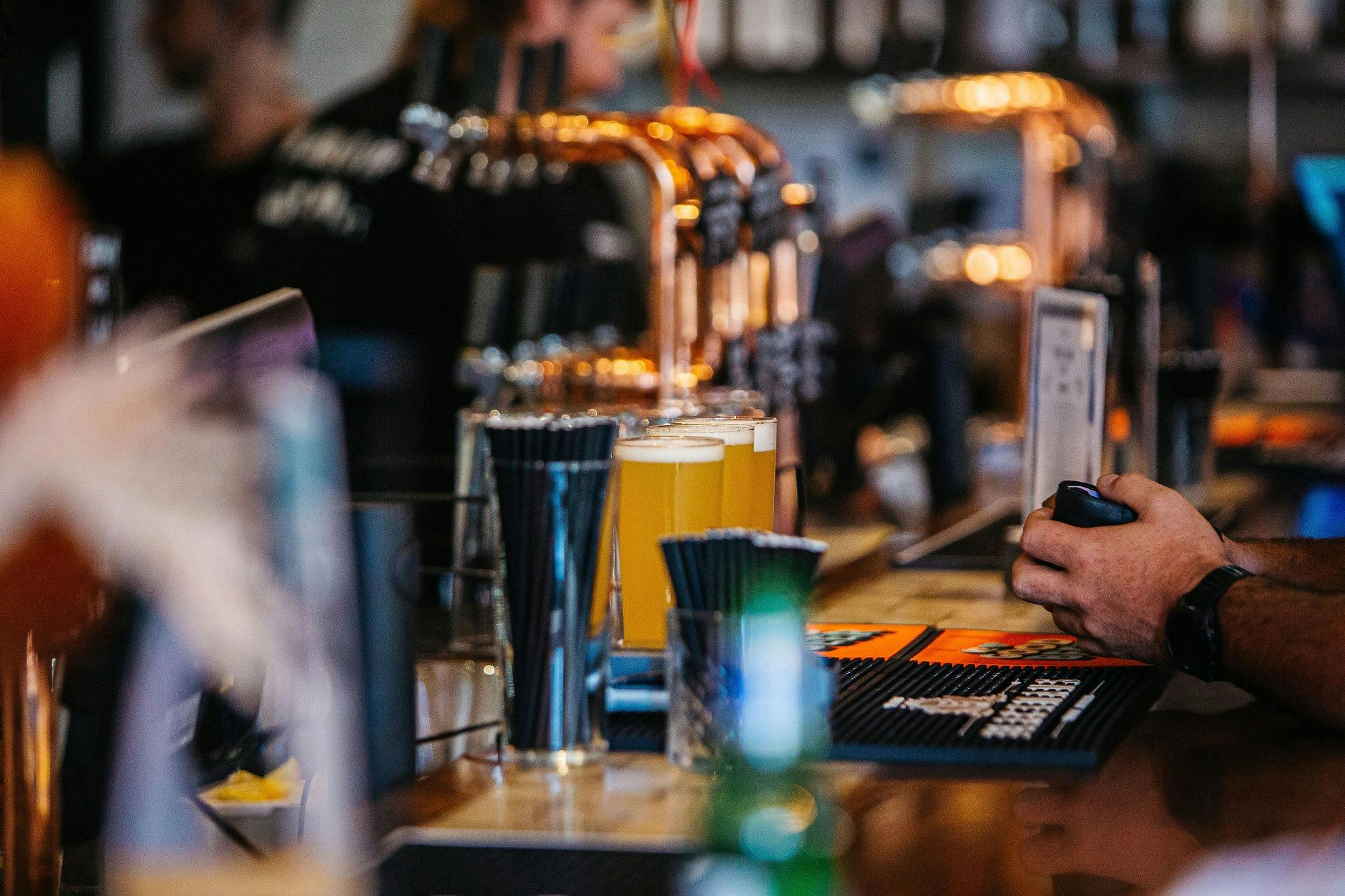 Customer waits to be served at the bar