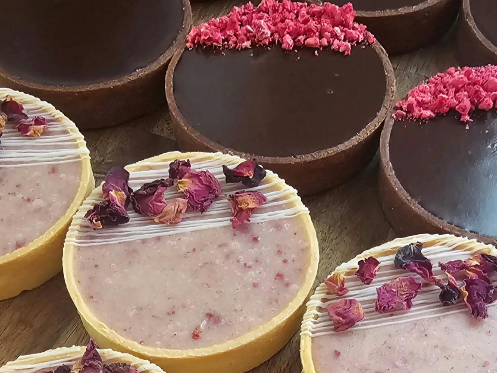 Various beautiful sweet treats in perfect lines.