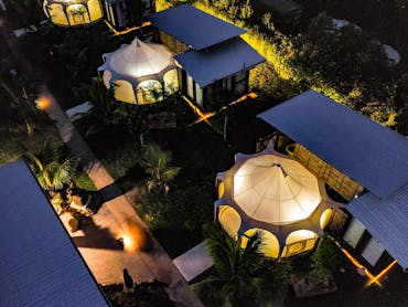 Immerse in nature without sacrificing comfort in our eco-friendly glamping tents. Each features: • P
