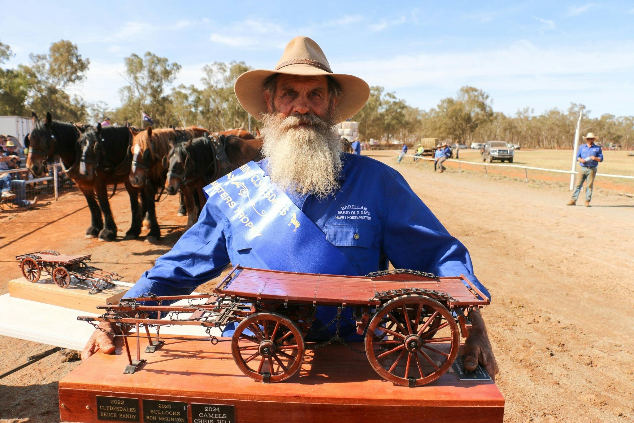 Man holding cart miniature entry