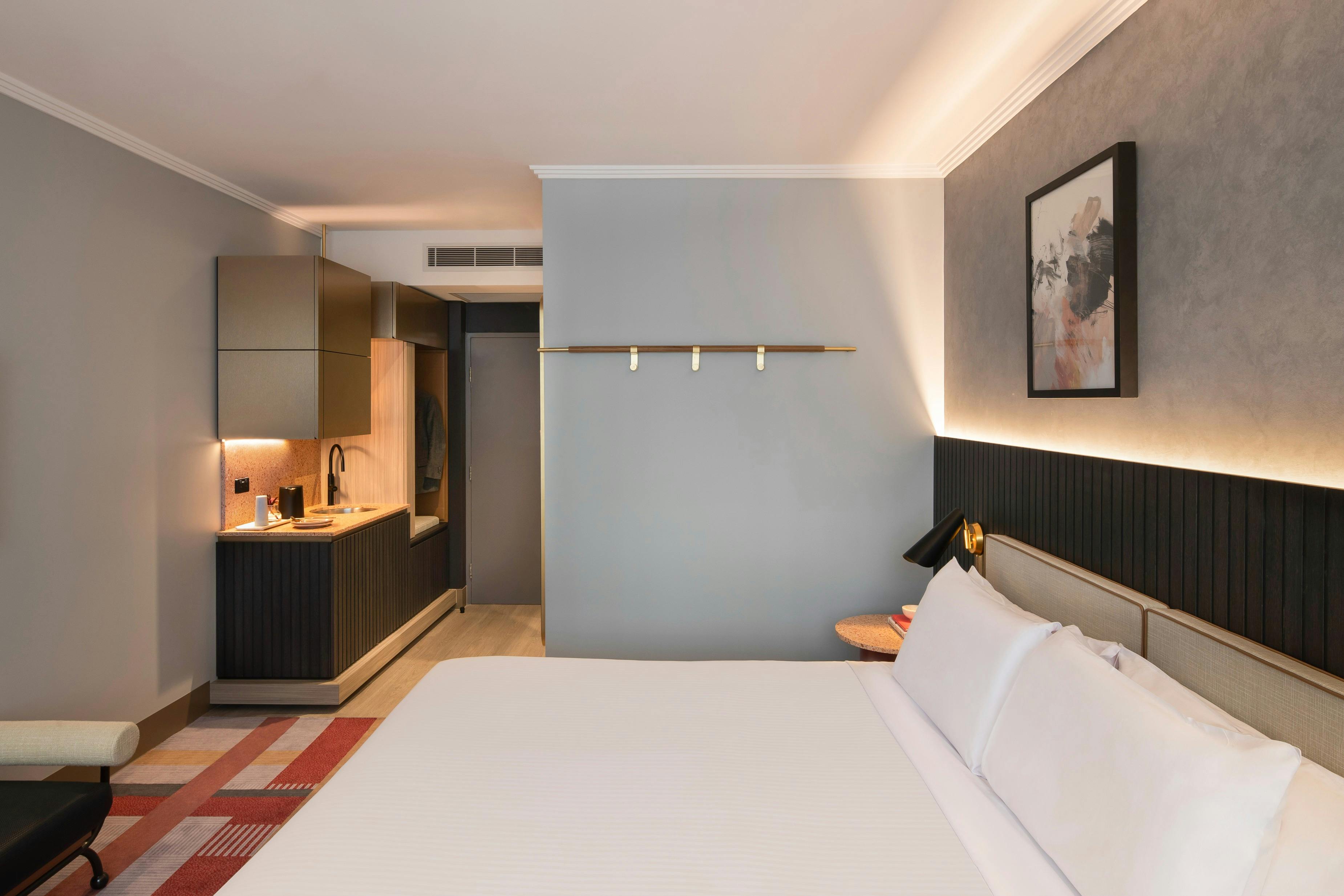 Picture taken from the window side showing Kitchenette and door