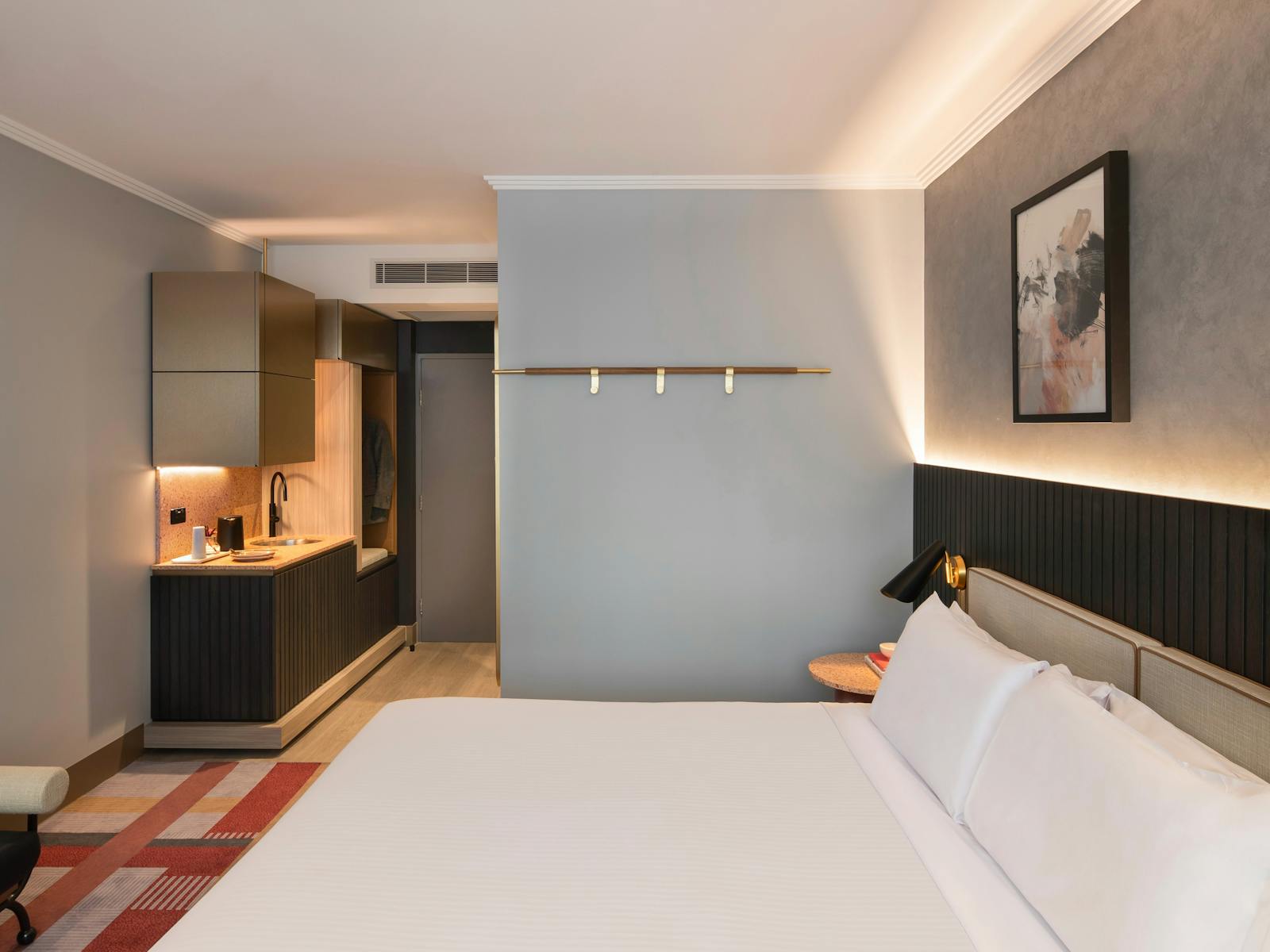 Picture taken from the window side showing Kitchenette and door