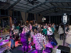 People dancing and singing at night time