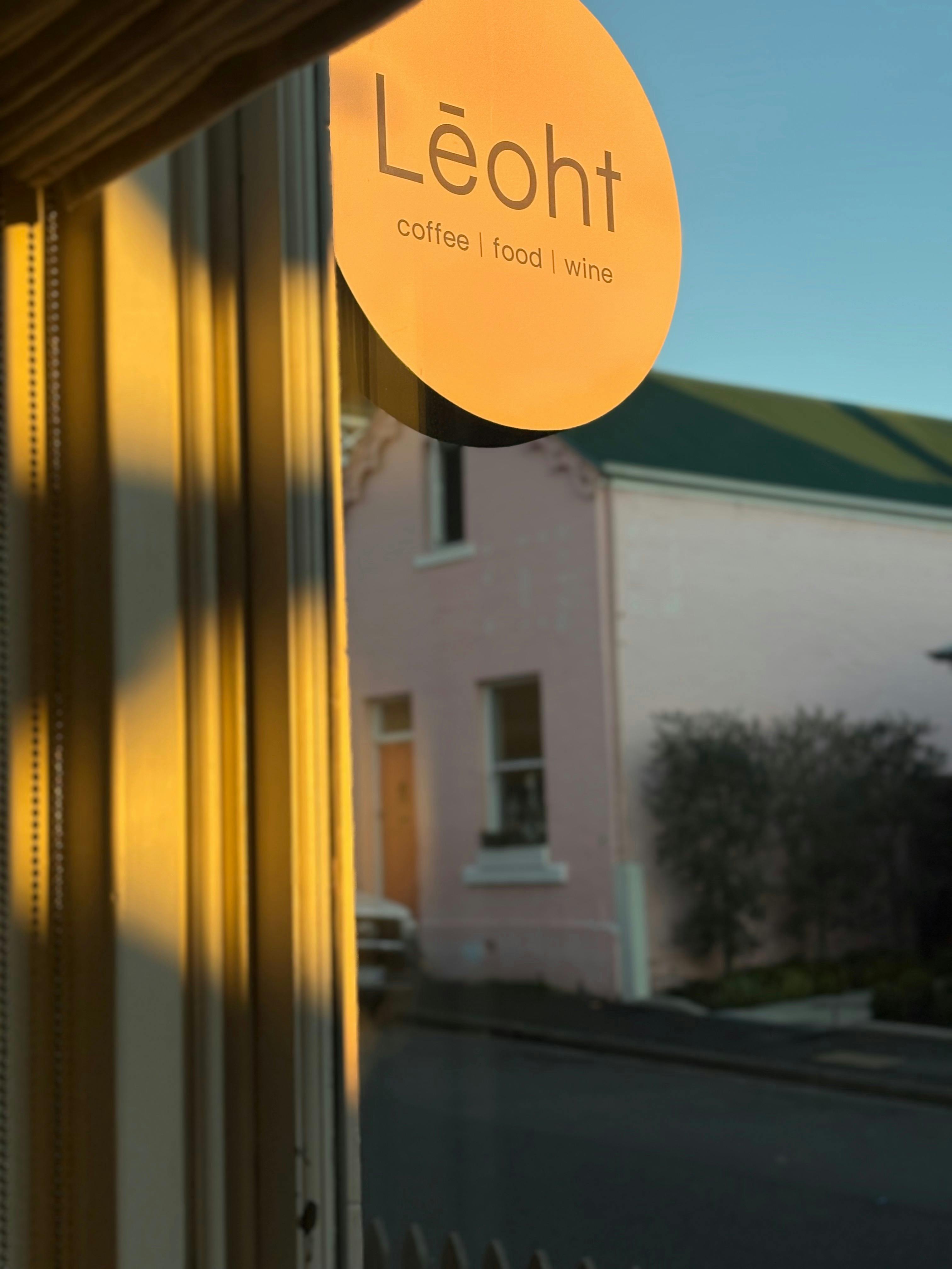 Early morning sun hitting Leoht sign
