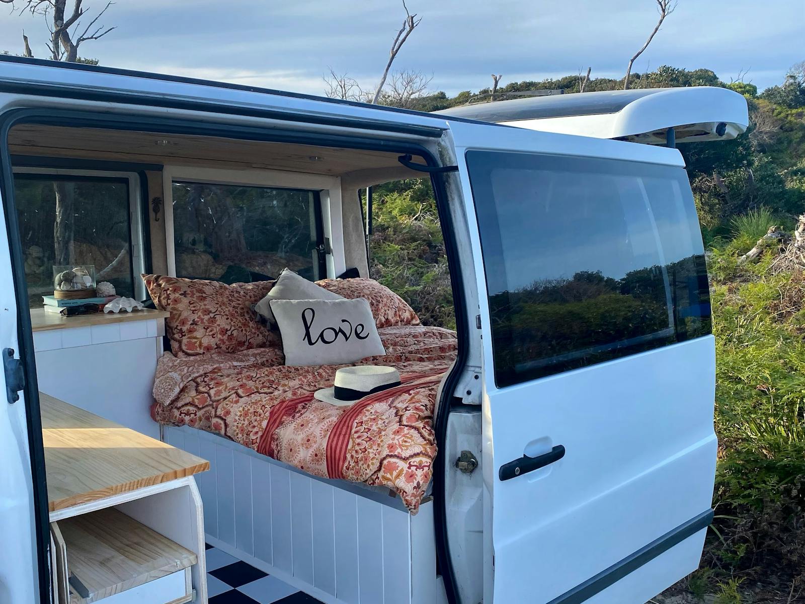 The inside of our van featuring a comfortable double mattress to comfortably sleep two.