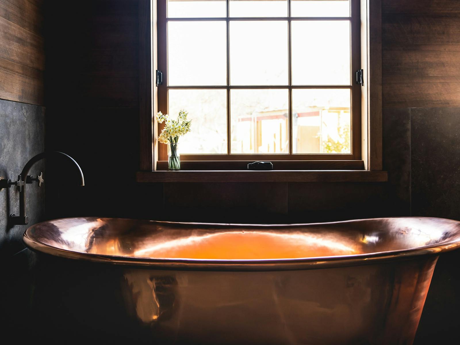 Experience the deep copper bath with views to Mount Wellington under a retractable veranda roof roof