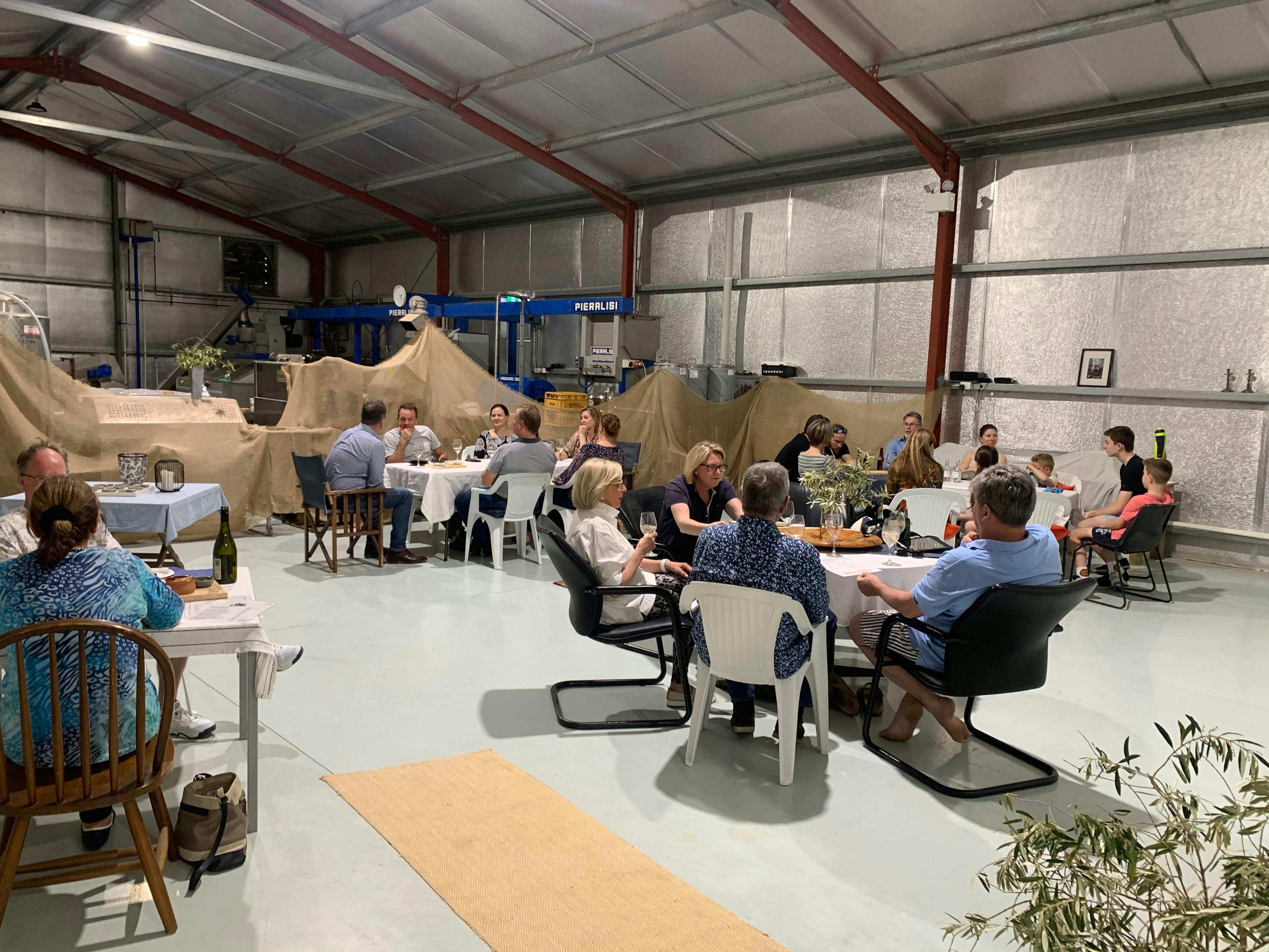 People enjoying a local produce platter in the Peninsula Providore Farm Shop