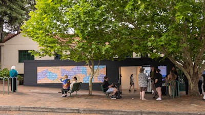 Image of Platform building with a crowd of people out the front