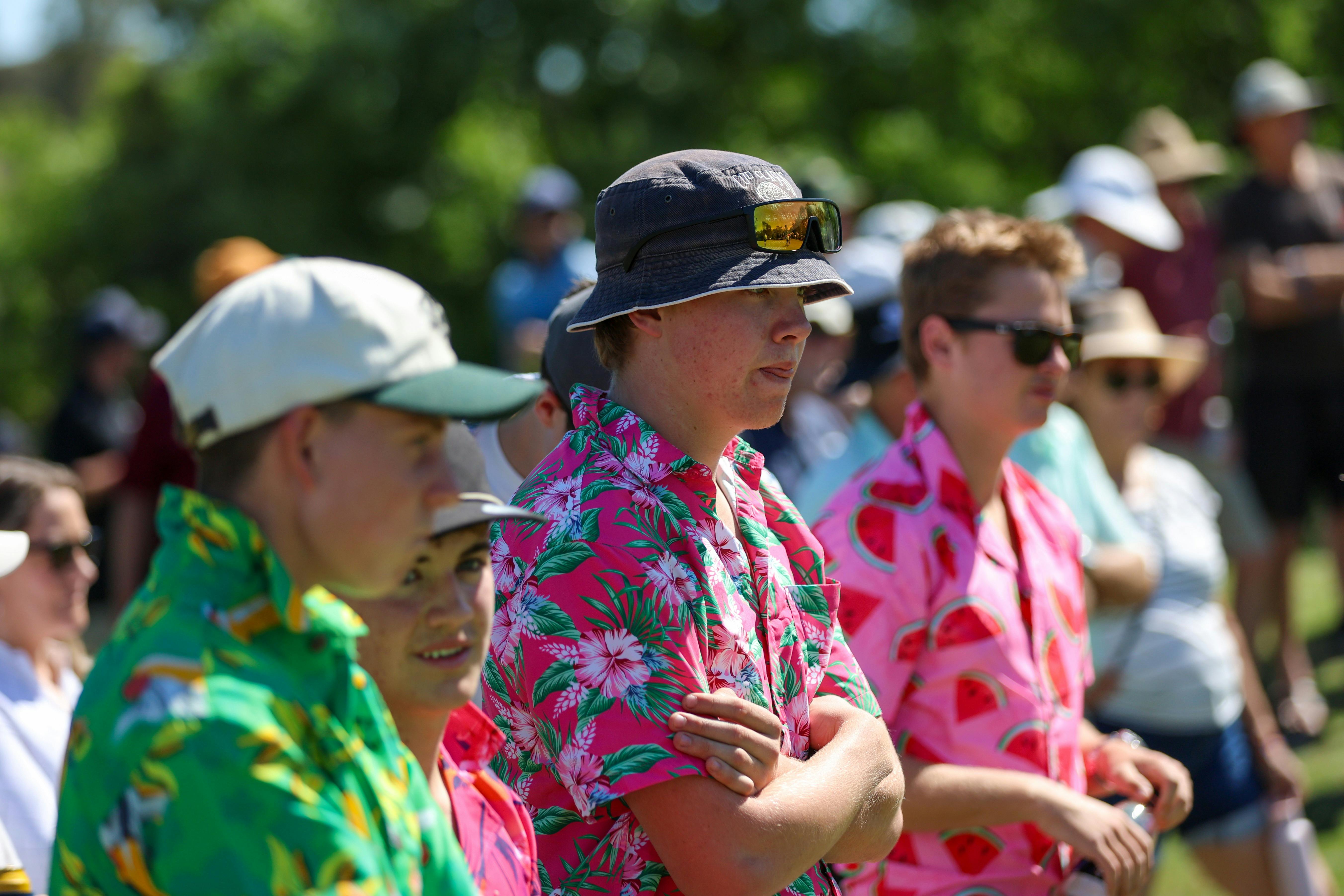 Young spectators in bright coloured shirts