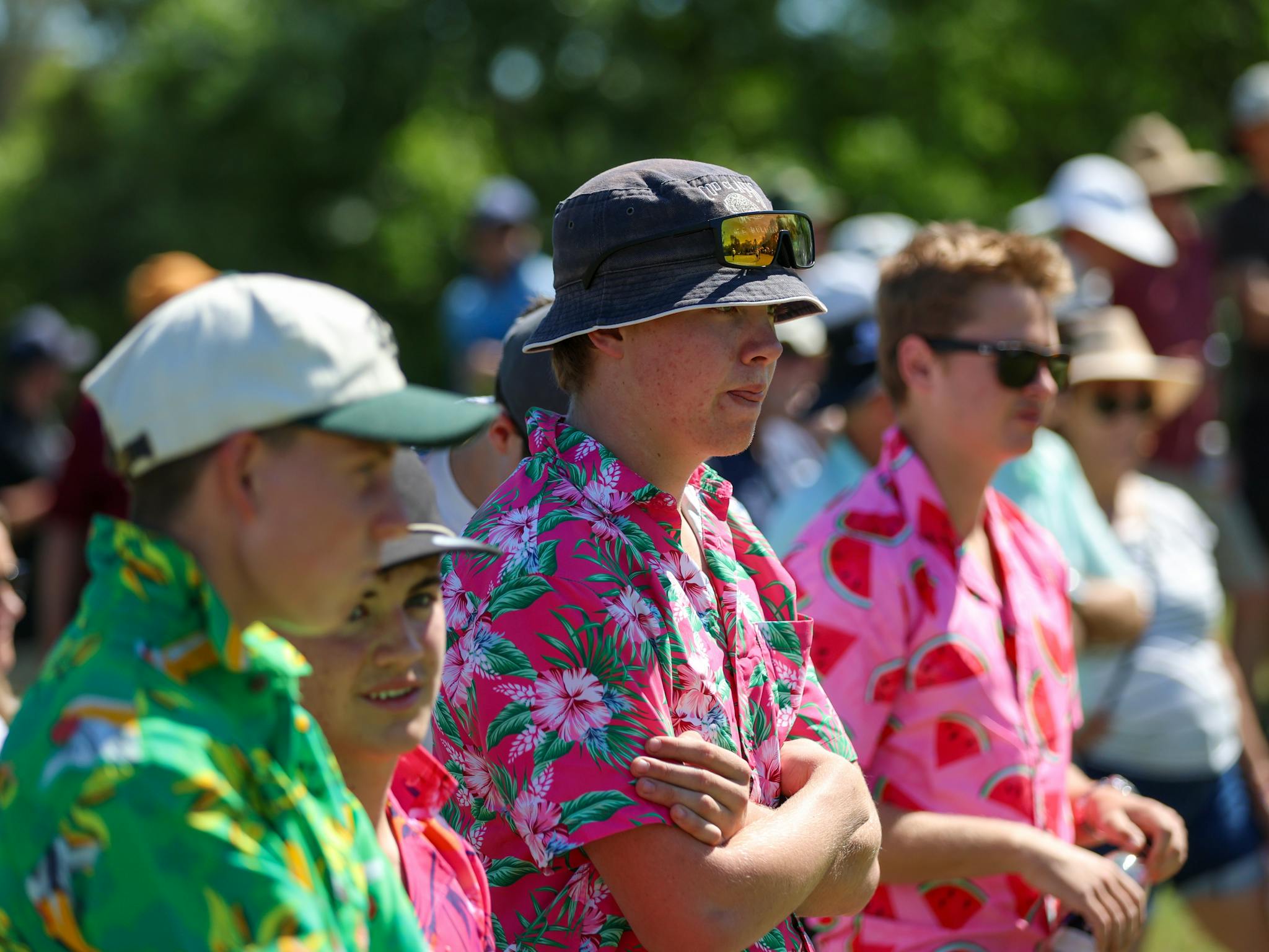 Young spectators in bright coloured shirts