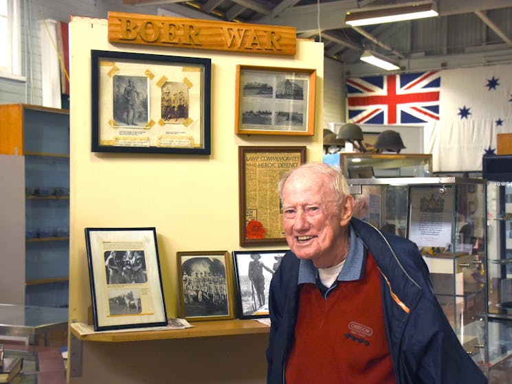 Museum volunteer with his family's collection.