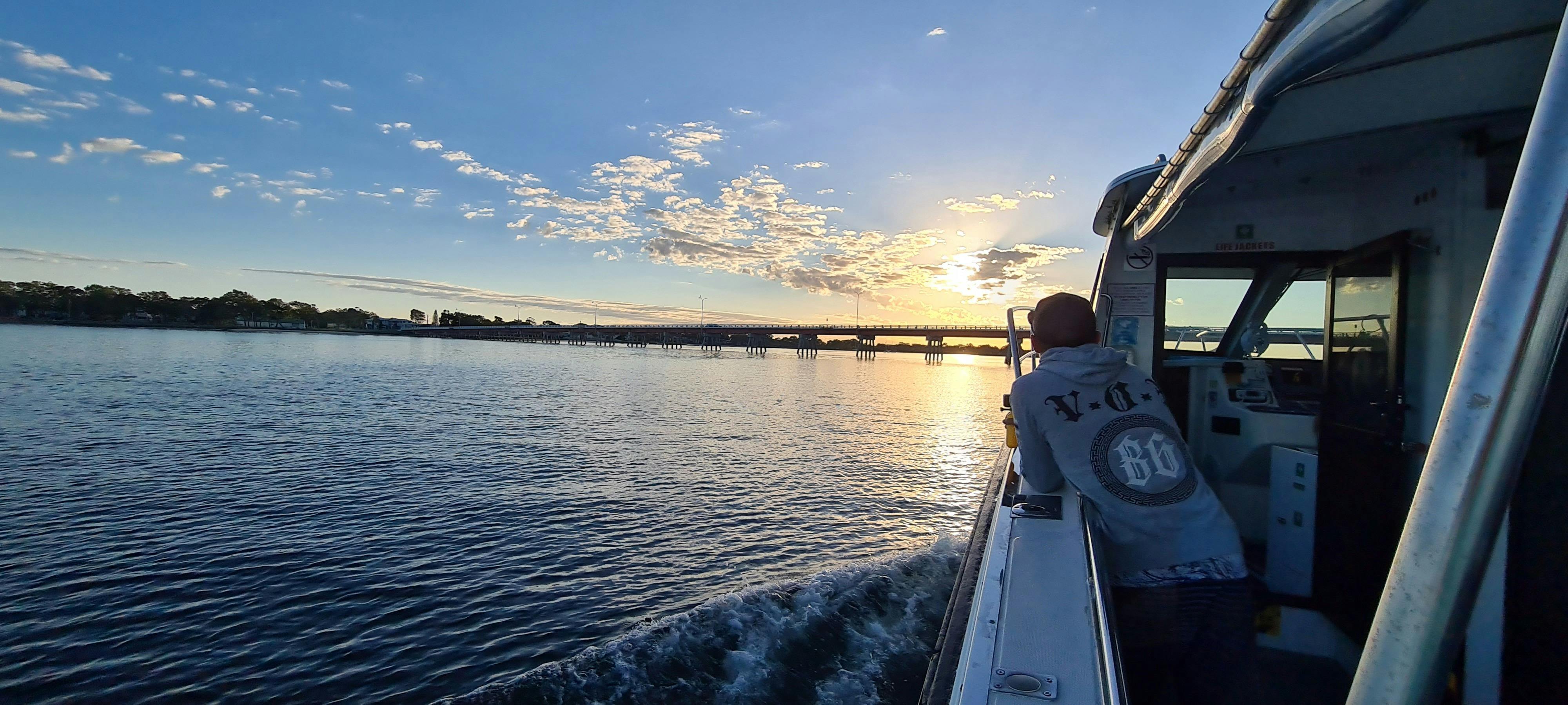 Sunrise over Bribie bridge view from onboard Prospector
