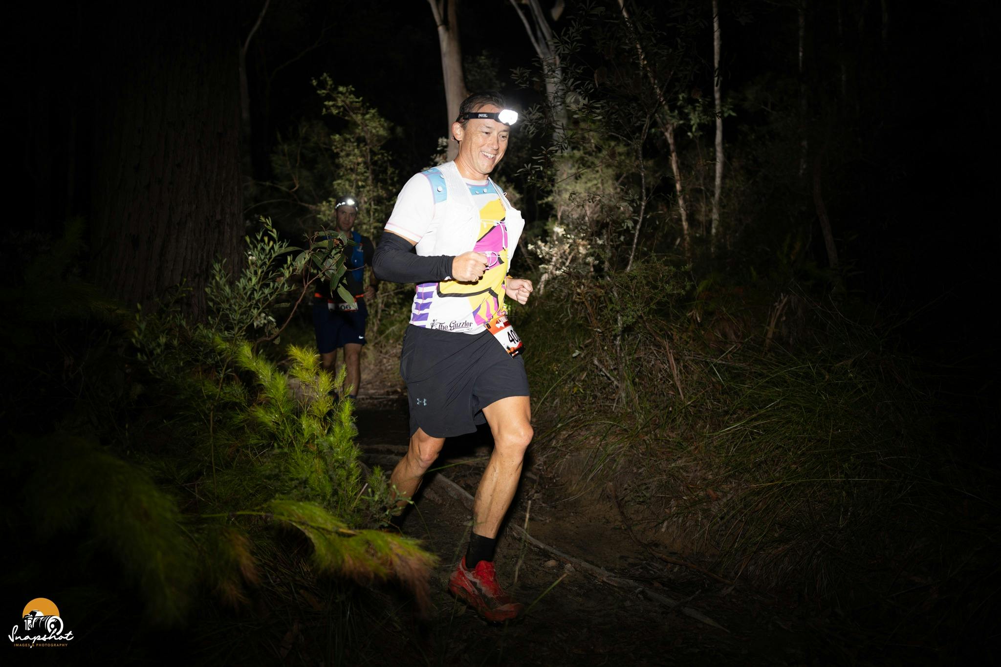 Trail runner during the night in the forest