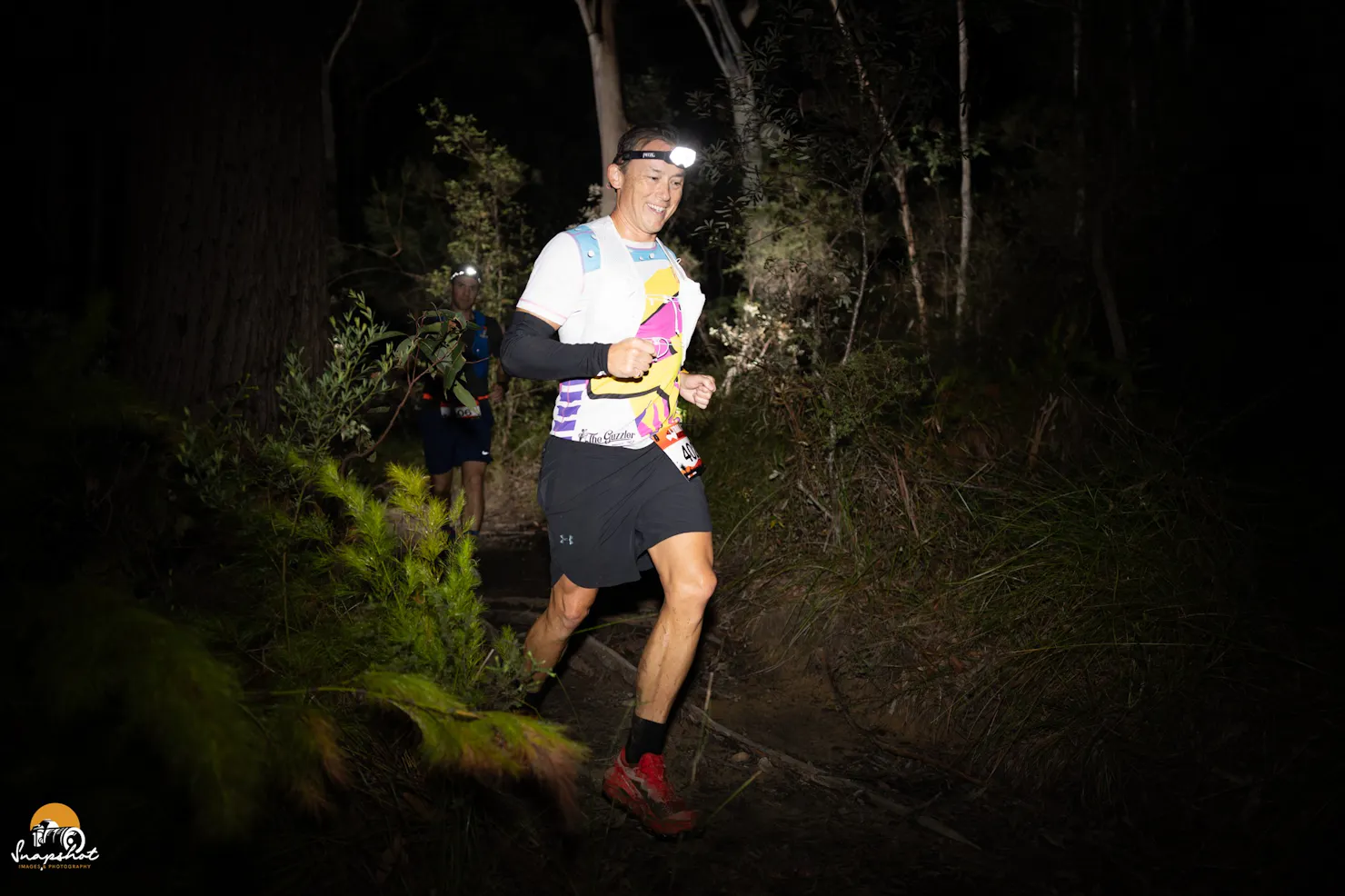 Trail runner during the night in the forest