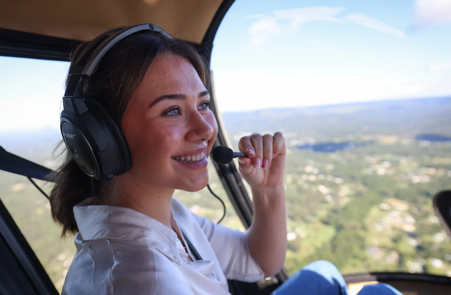 A passenger enjoying a flight across the Sunshine Coast