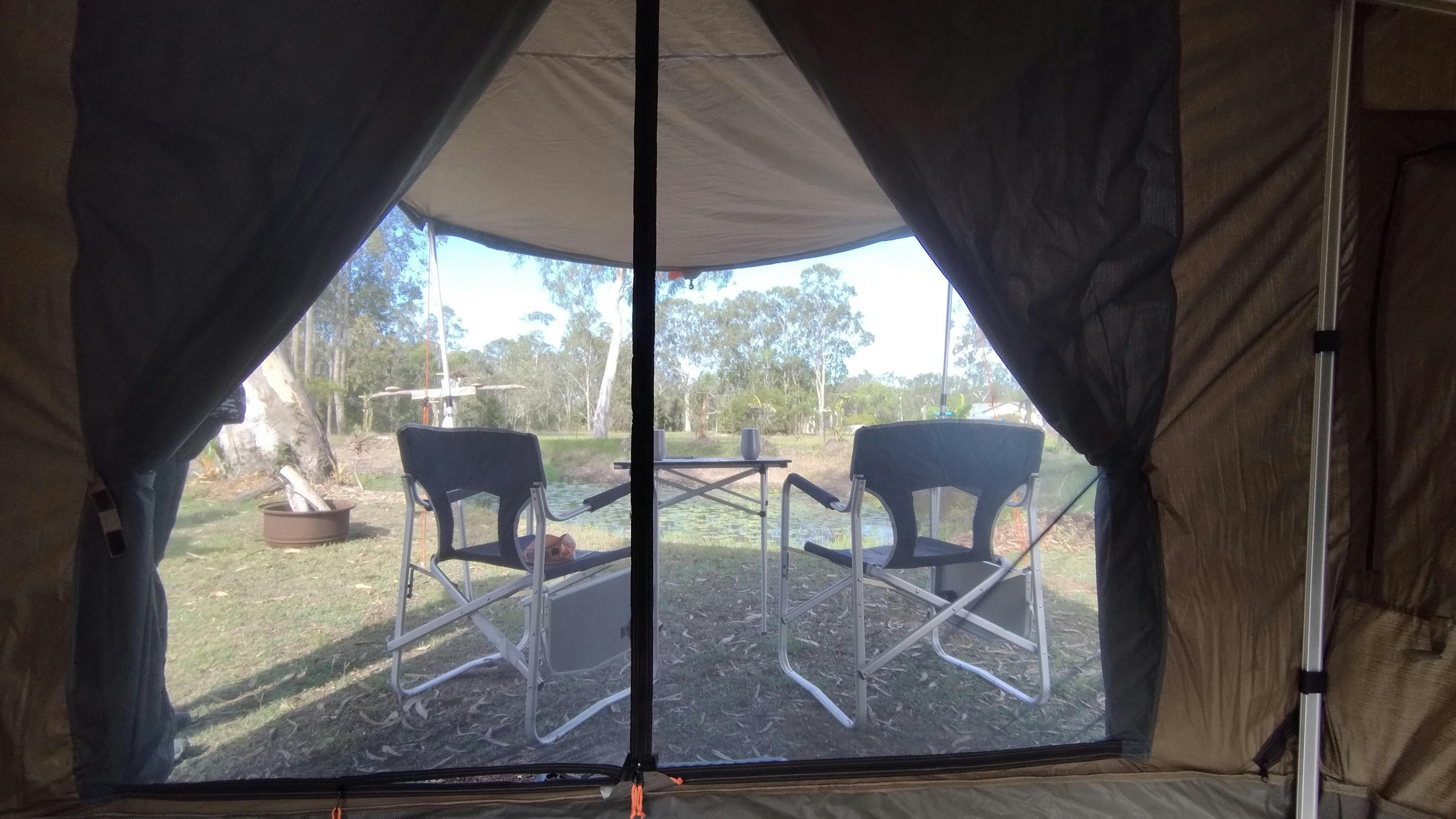 looking out from inside a safari tent