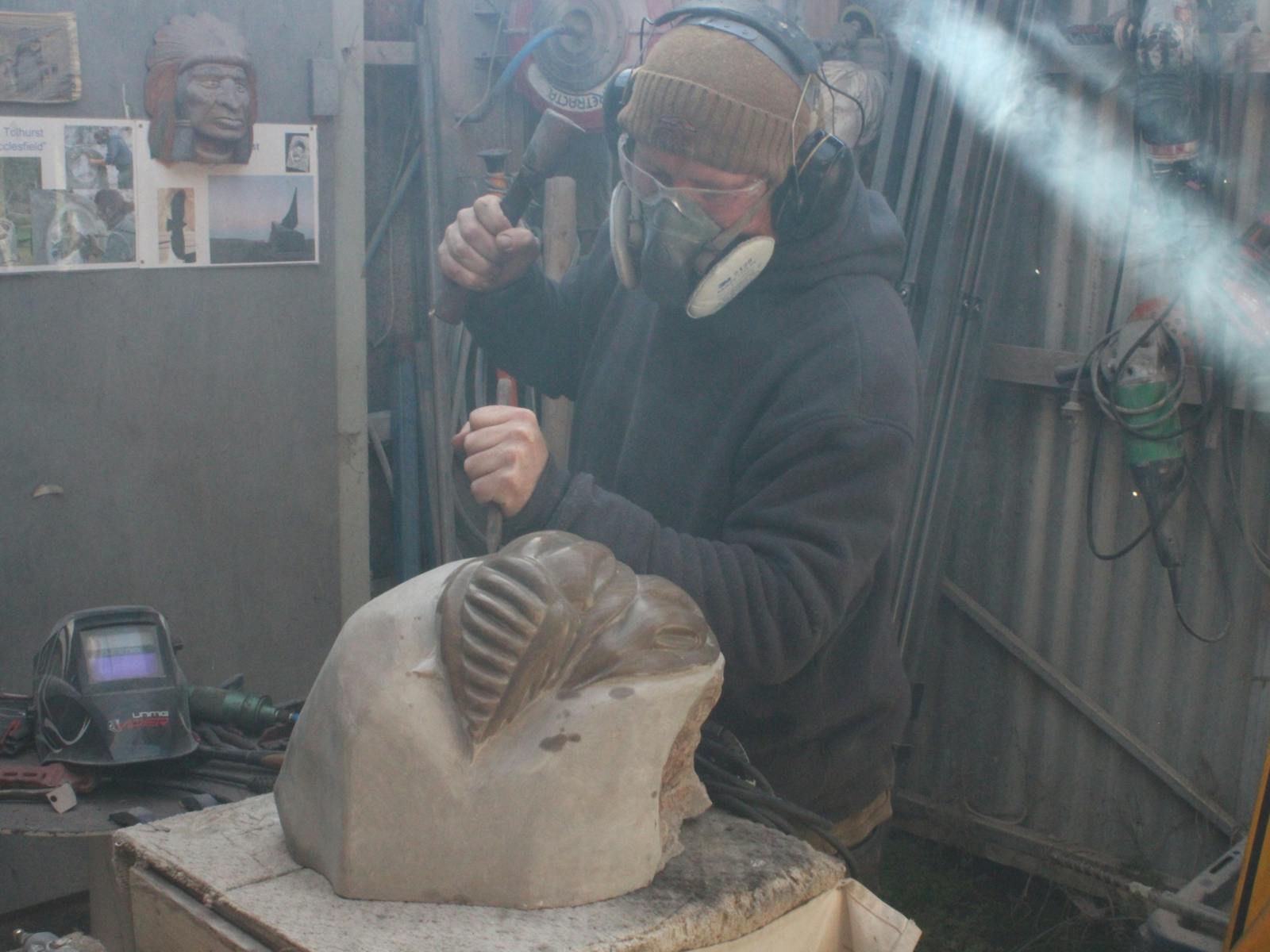 Stonemason chiselling stone