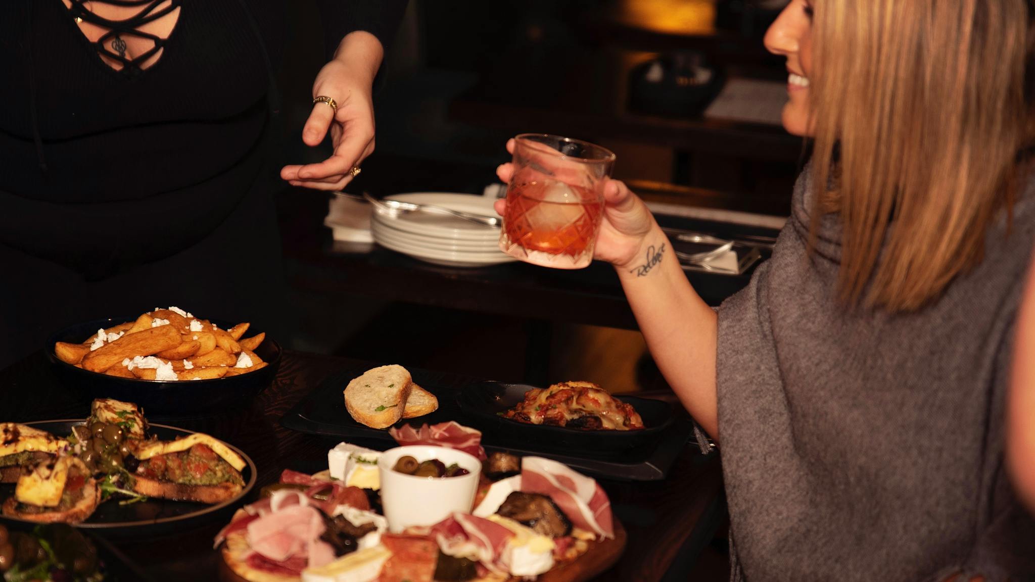Shared meals and cocktails Shared meals and cocktails