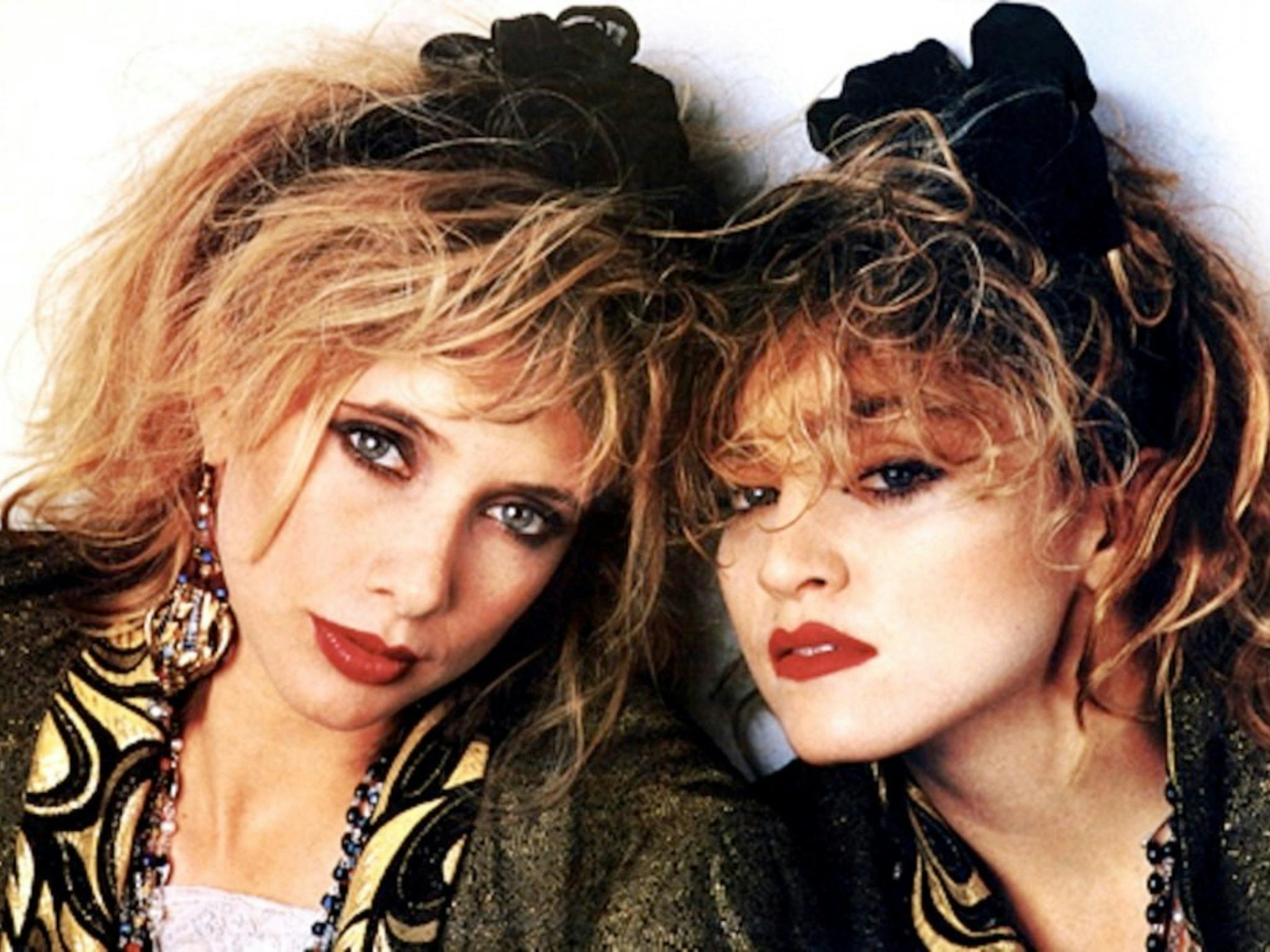 Portrait of two similar-looking women dressed in 1980s fashion