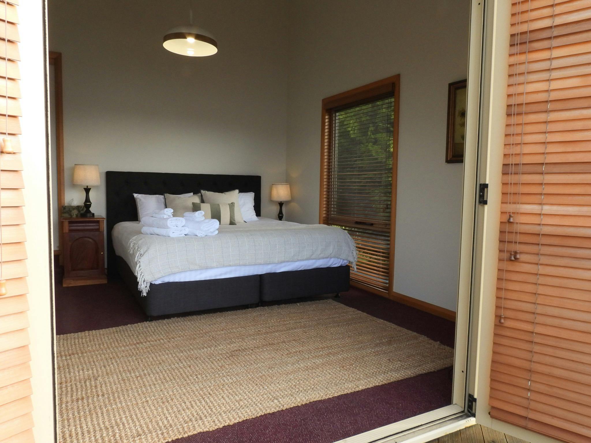 King size bed, door opens on to belcony with beautiful views of the ocean