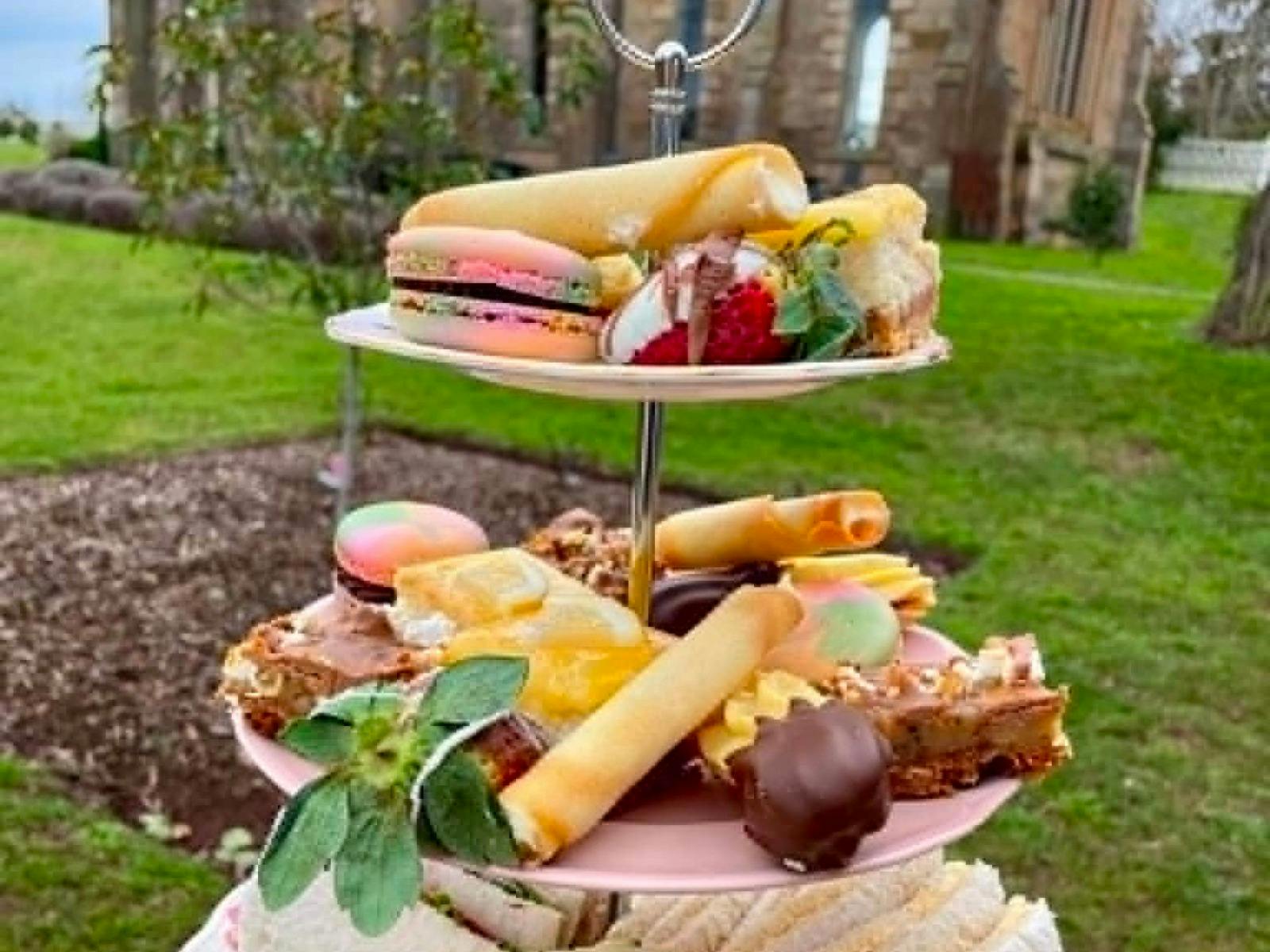 High Tea 3 tiered plate in front of The Church Tasmania