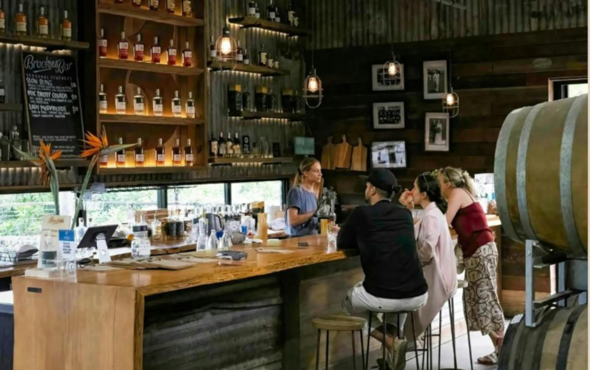 people enjoying drinks at a distillery