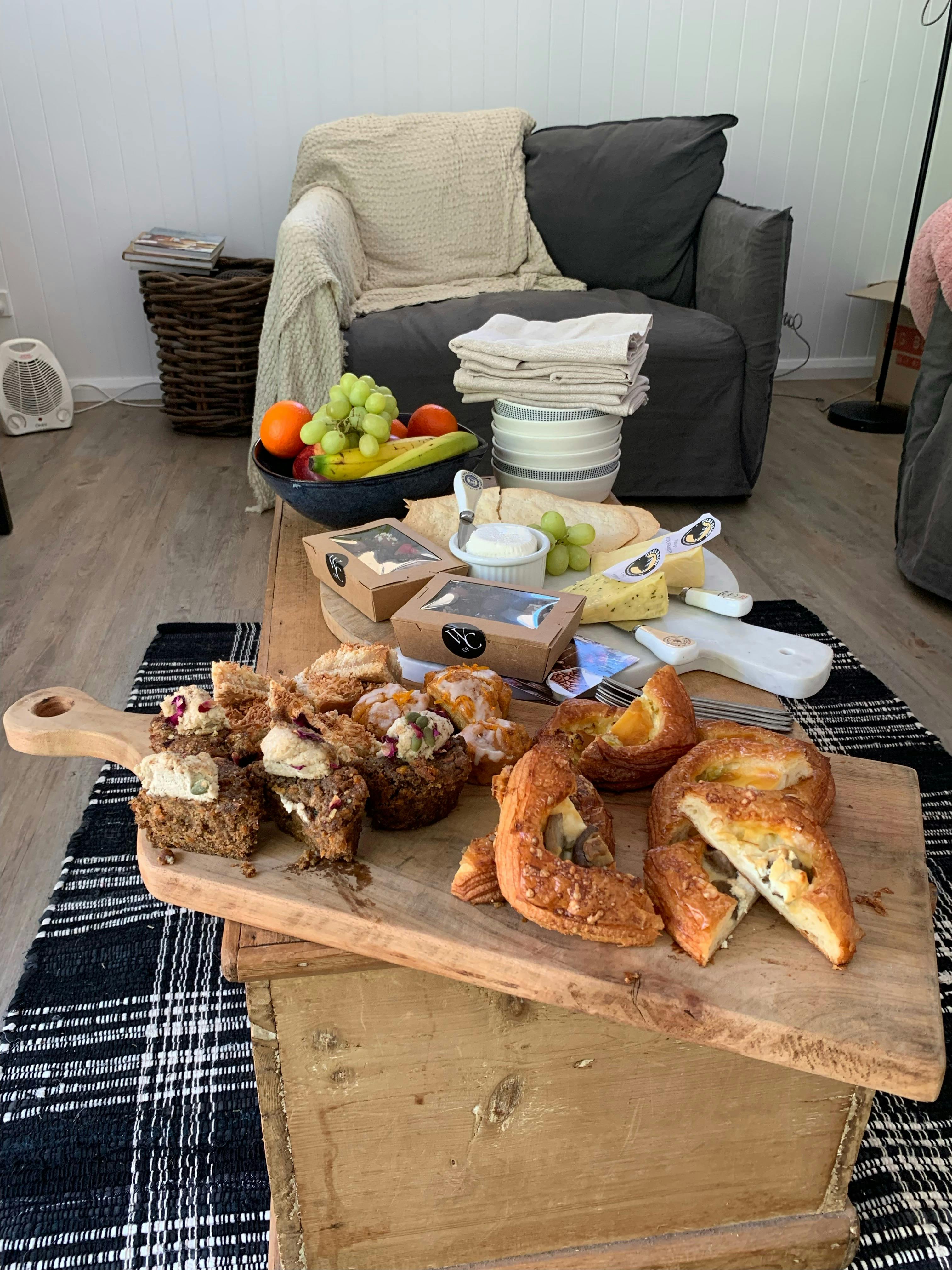 Afternoon tea delights, pastries cheese chocolates and fruit