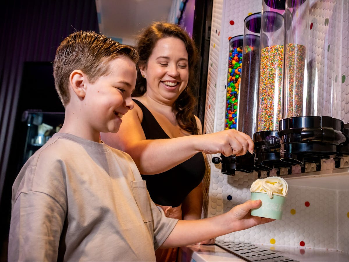 Woman and child serving ice cream