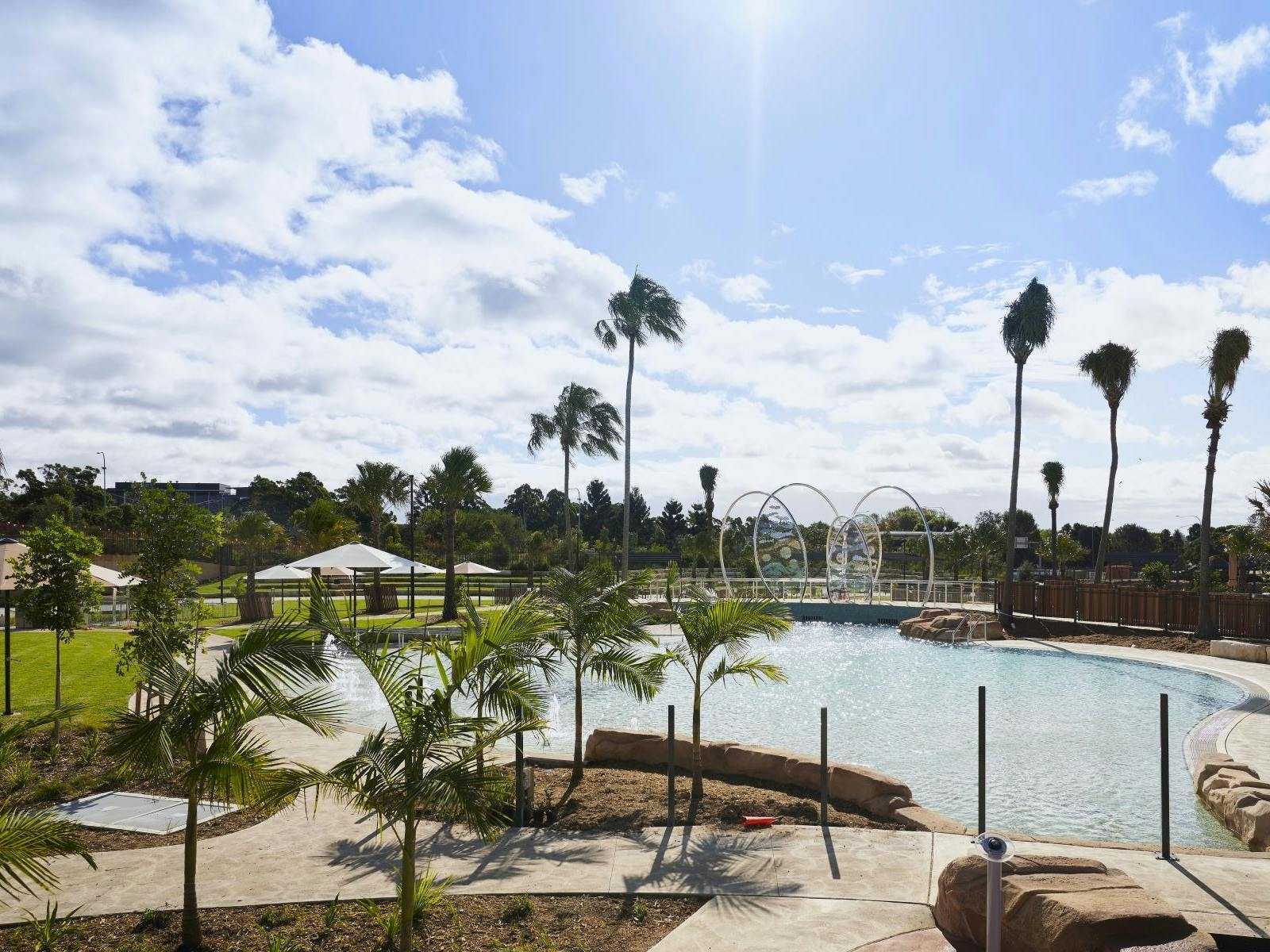 Image of a naturally landscaped swimming pool that looks like a billabong