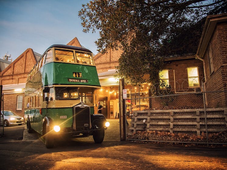 Vintage double decker bus departing the museum