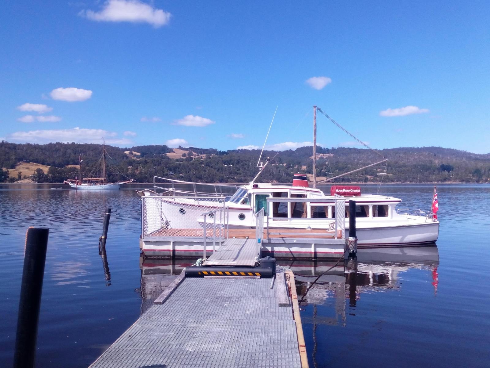 La Drone at the dock with Yukon sailing past, Huon River Cruises