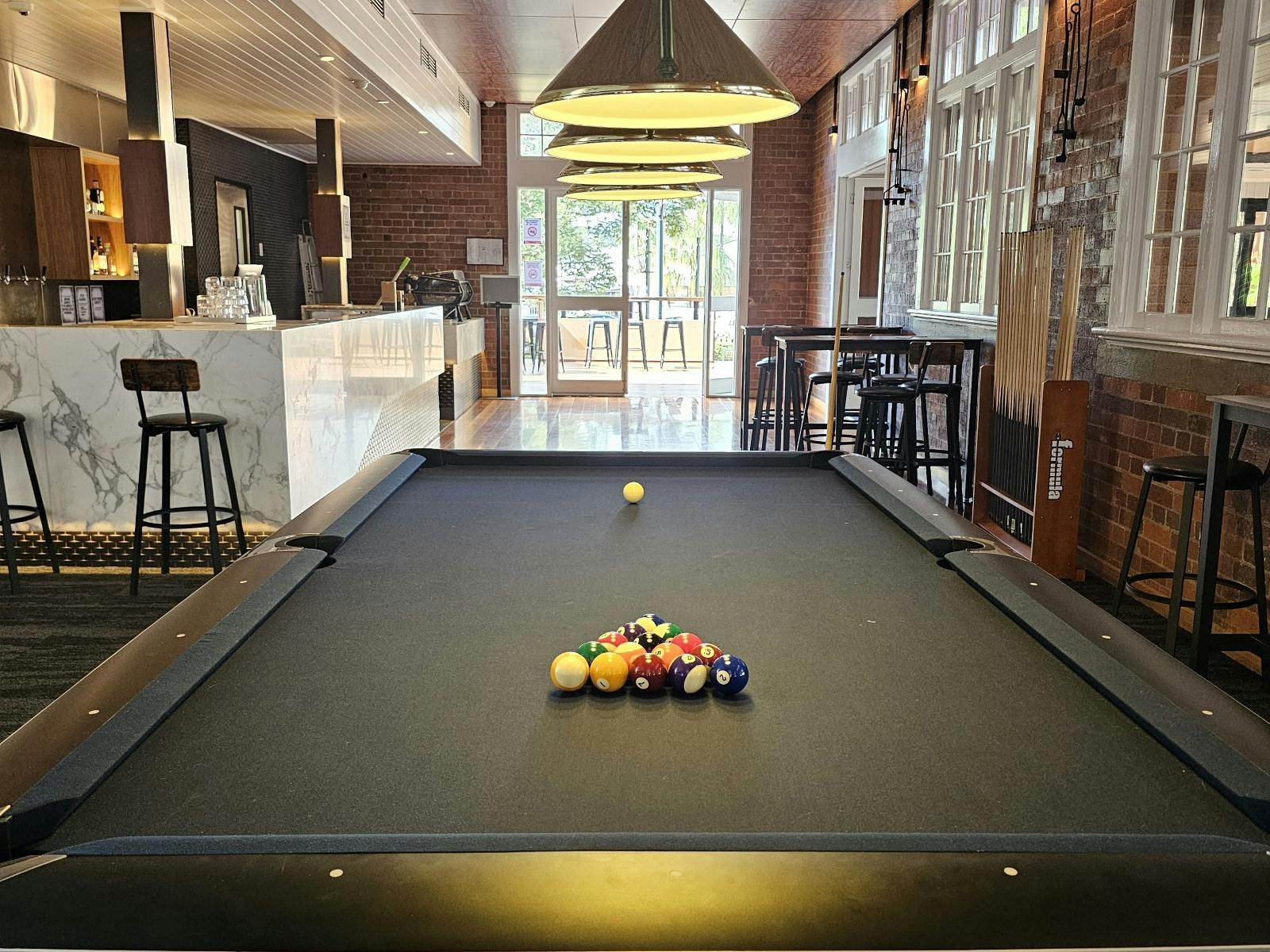 9" American Pool Table with midnight blue felt. 8 Ball pool balls set up ready for a game. 9" American Pool Table with midnight blue felt. 8 Ball pool balls set up ready for a game.