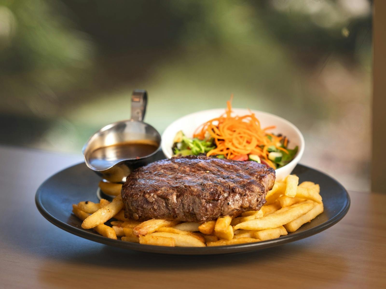 Steak, chips and salad