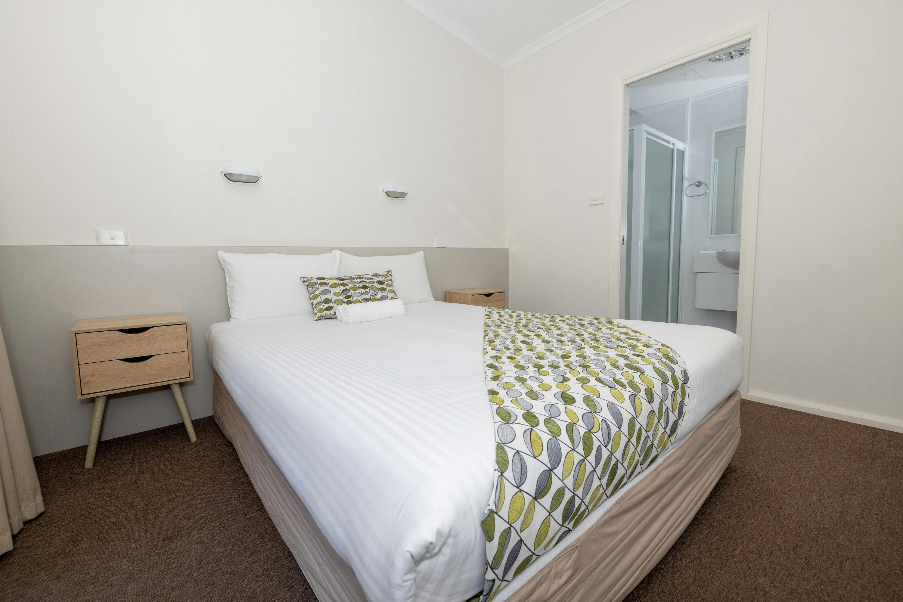 This is the bedroom of the Main Beach Villa with an ensuite bathroom