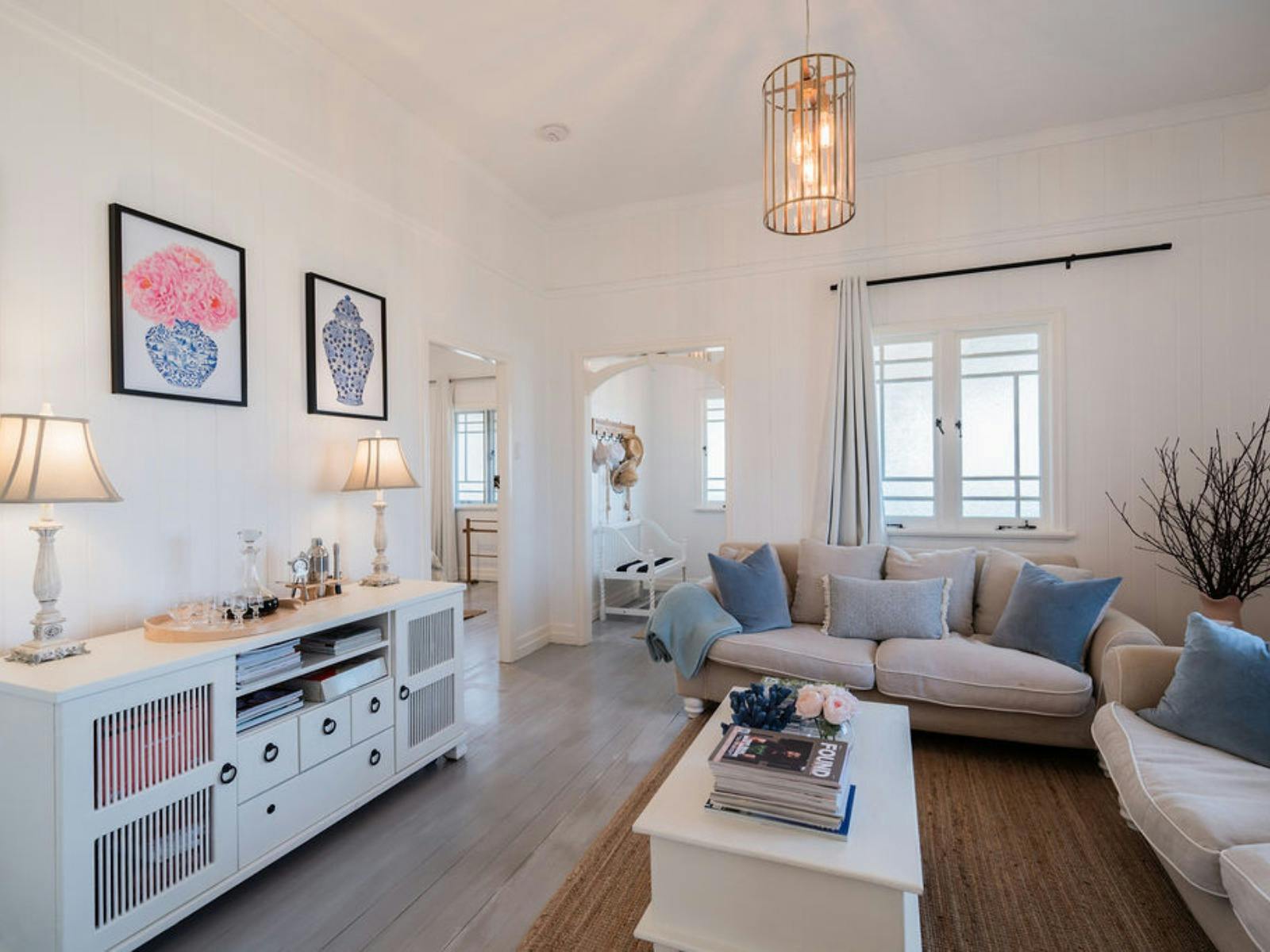 Feather filled lounges and sideboard in lounge room