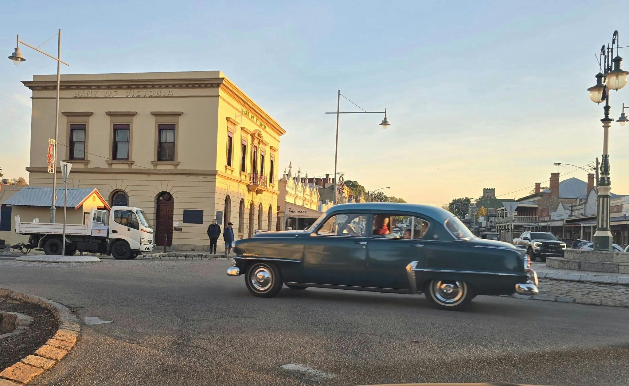 A vintage car driving on the streets of Beechworth