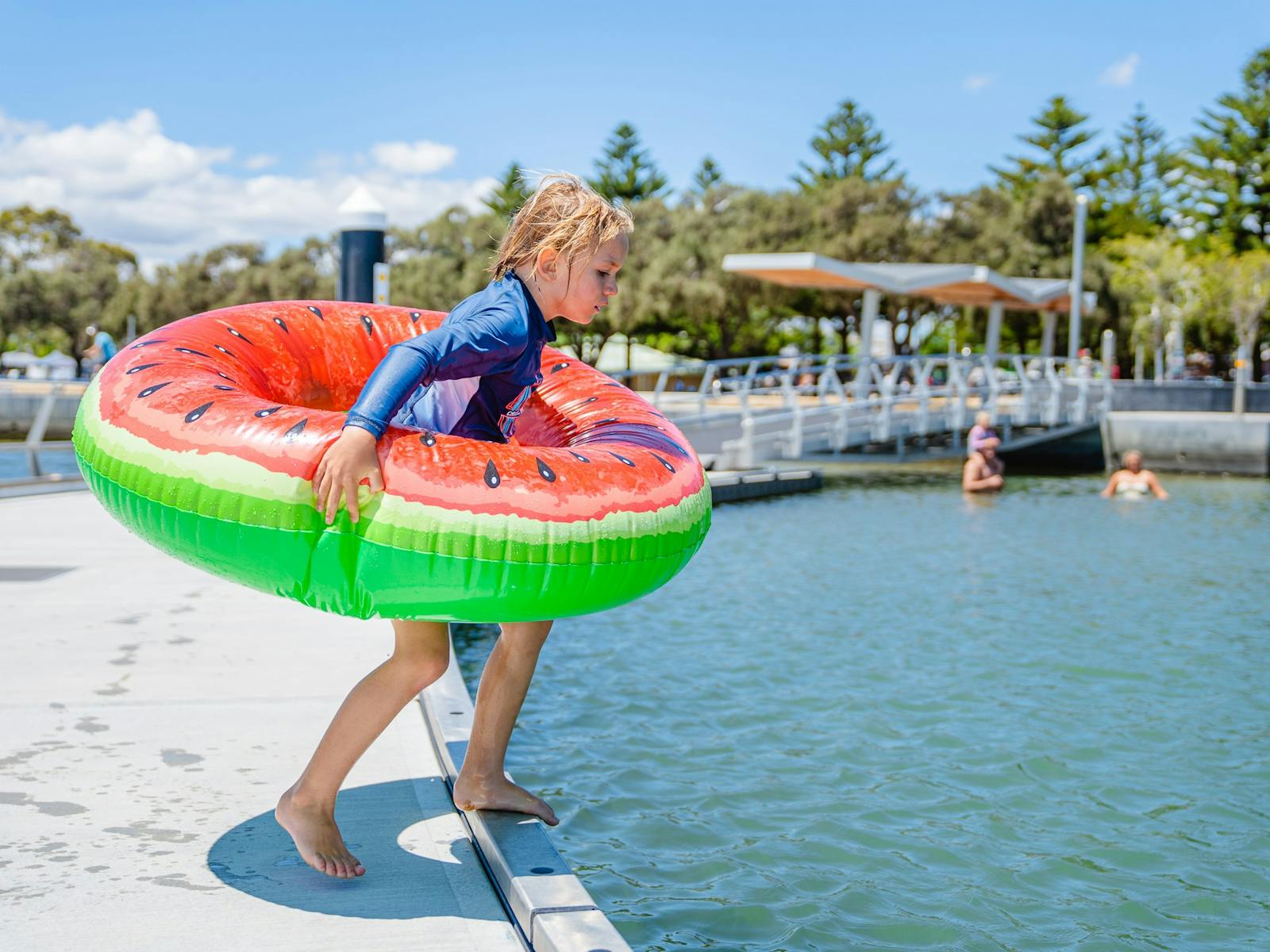 Boy jumping into Kwillena Gabi Estuary Pool in Mandurah