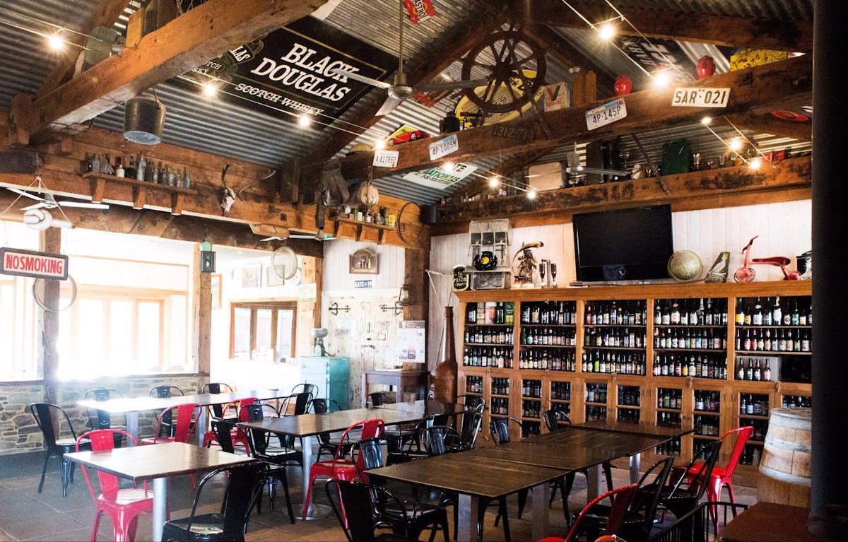 Eclectic decoration in the dining room at Smiling Samoyed Bottle Wall