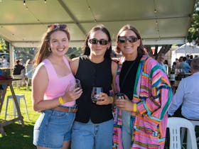 three guests enjoying the sun and wine on offer at the koonara wines mount gambier summer fiesta