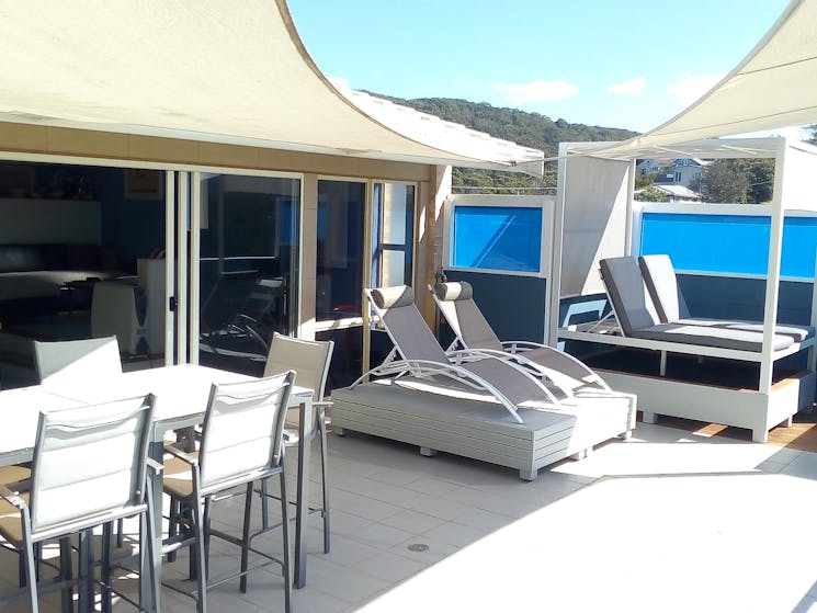 View deck with sunlounges, day bed and otdoor dining  & BBQ