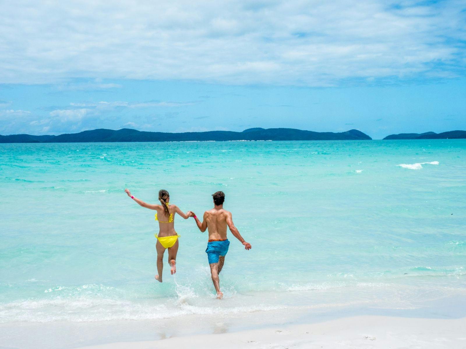 A couple in the water at the beach