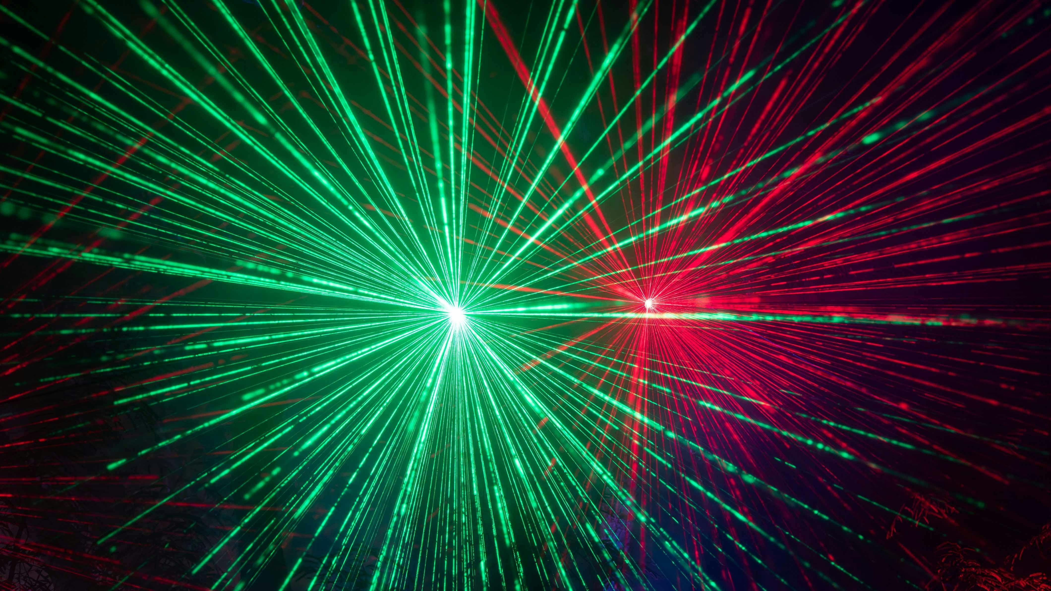 Red and green star light lasers project into the night at Radiance Rockhampton Light Show.