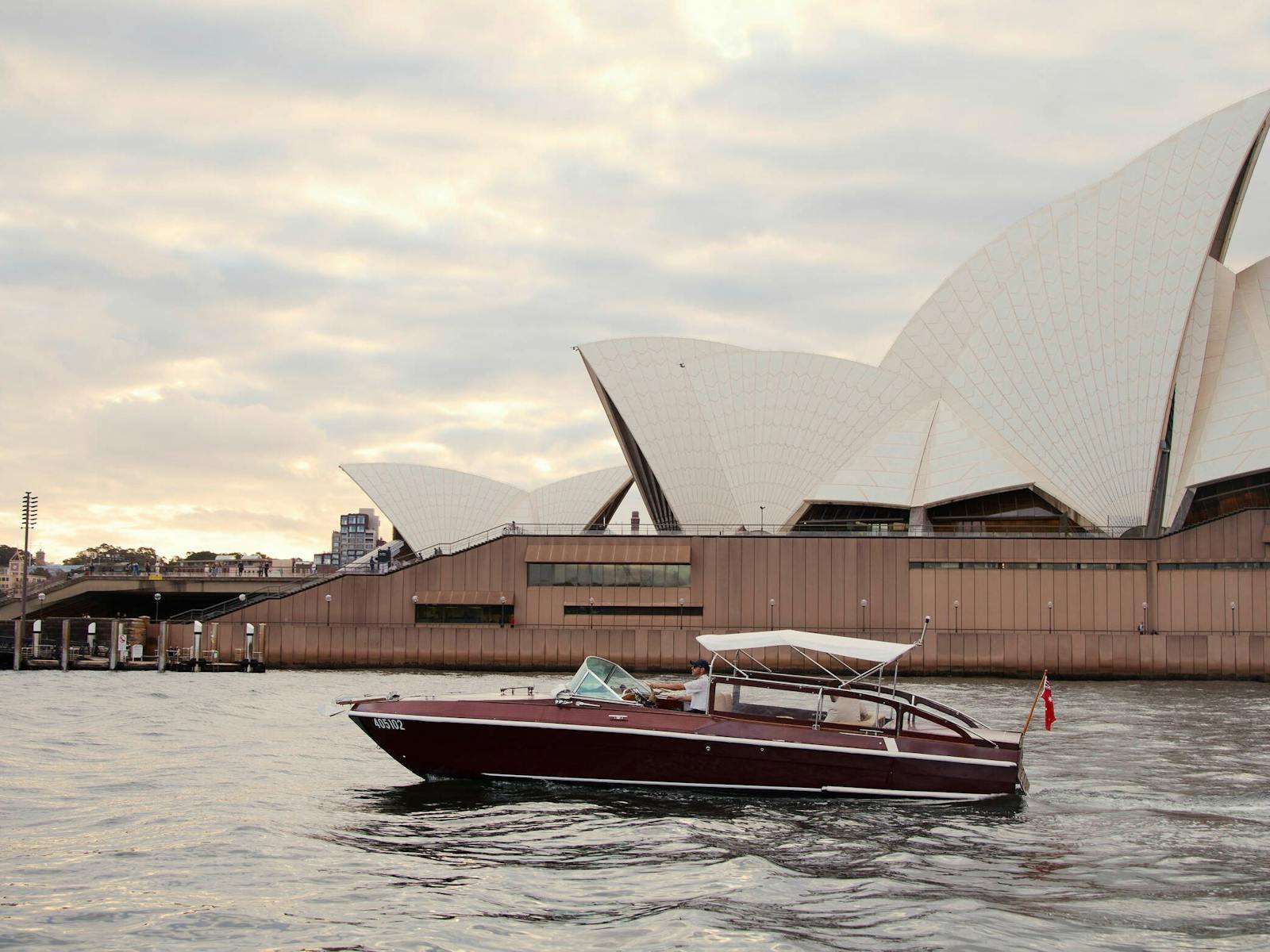MV BEL private cruise on Sydney Harbour with Sydney city skyline and Harbour Bridge.
