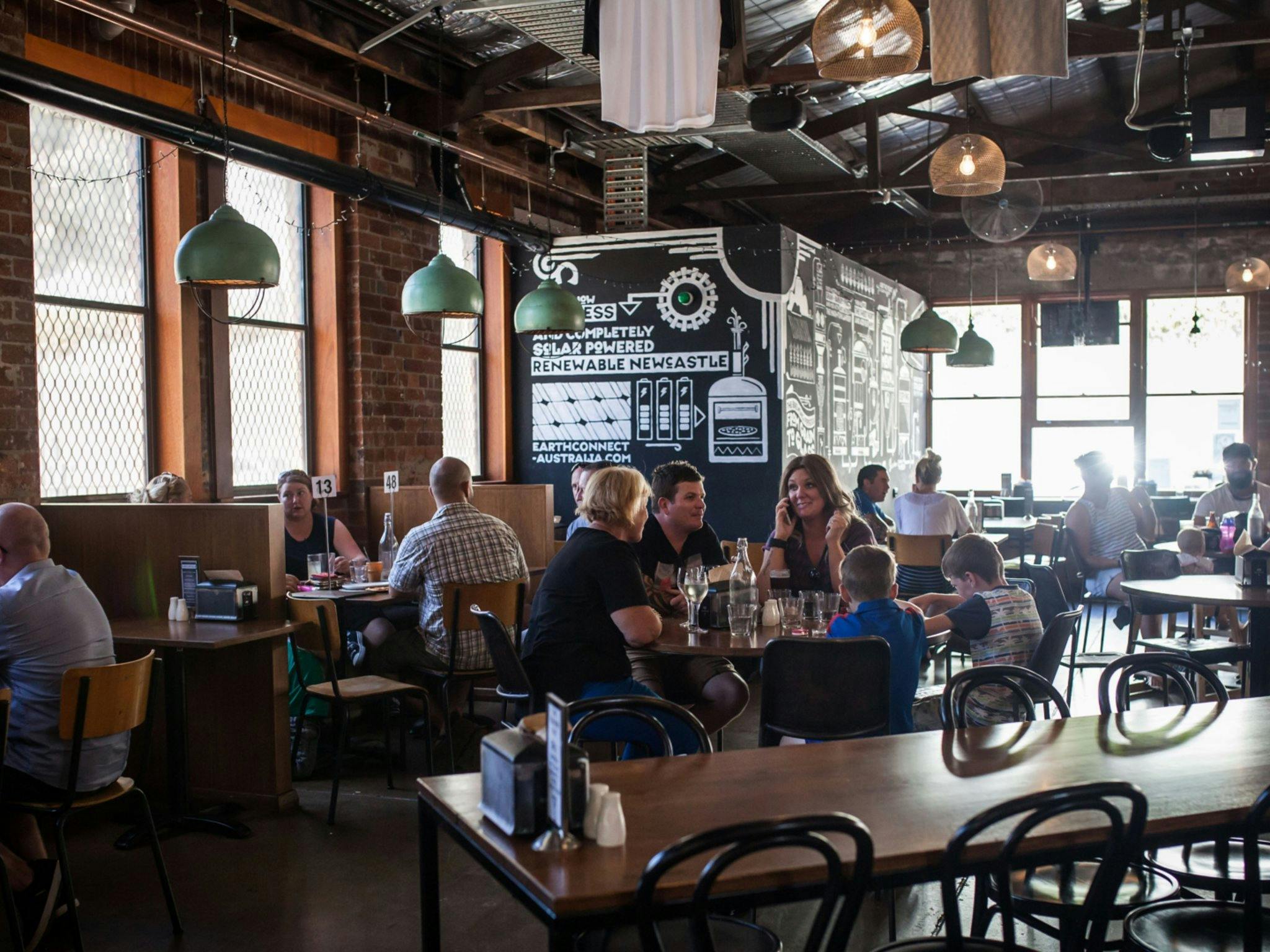 Many customers and young families dining inside FogHorn Brewhouse