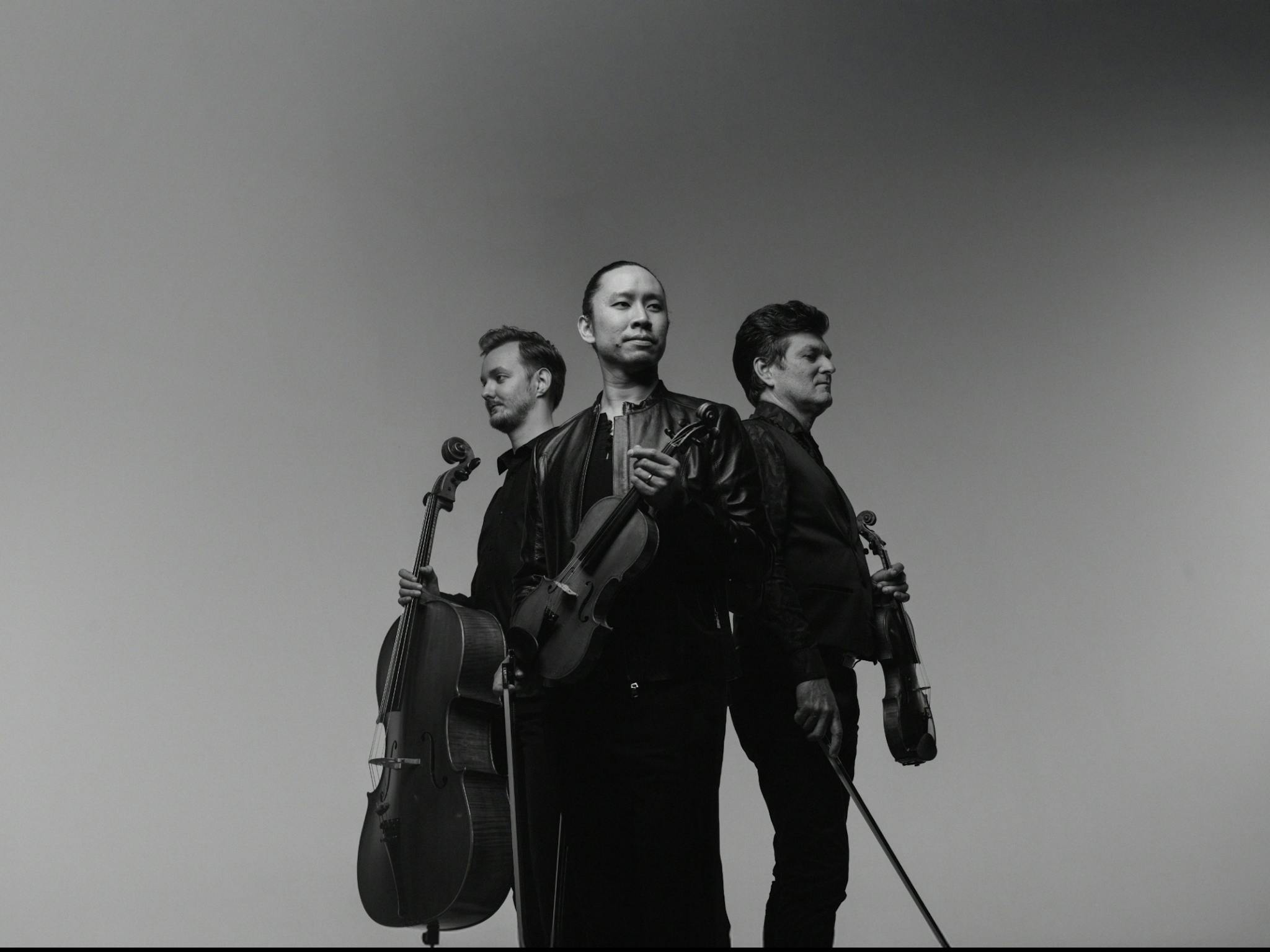 Rory Smith holding Cello, Jason Tong holding Violin and Brendan Joyce holding Violin Rory Smith holding Cello, Jason Tong holding Violin and Brendan Joyce holding Violin