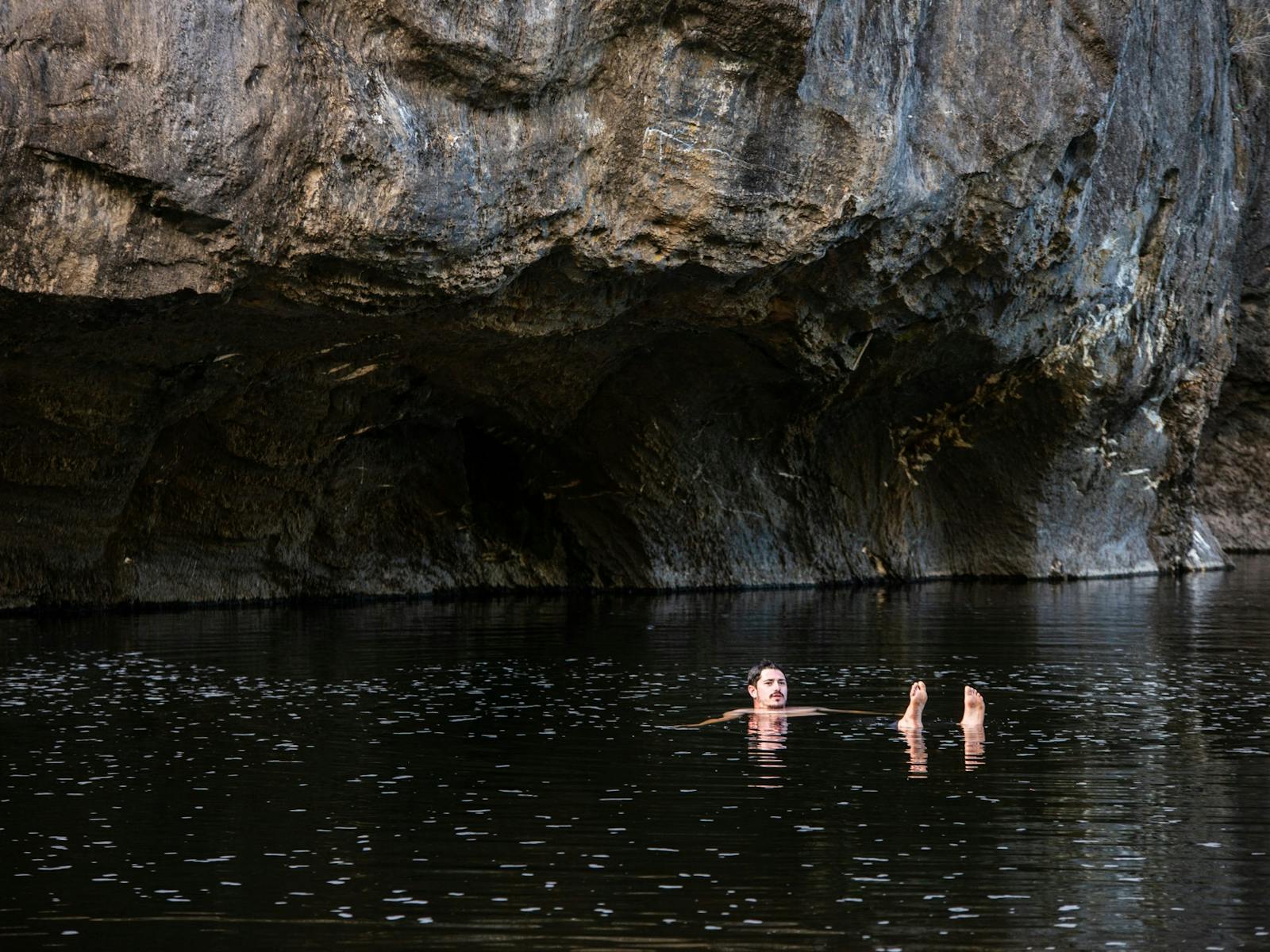 Swimming in a river on a guided packrafting tour in Tasmania