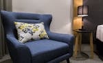 Comfortable armchair in guest room at Quality Hotel Rules Club