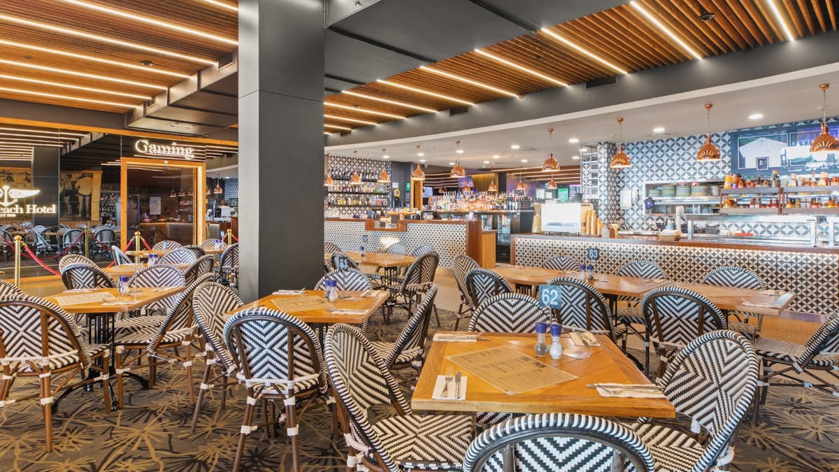 Bistro area at The Pub Airlie Beach Hotel with outdoor seating coastal decor