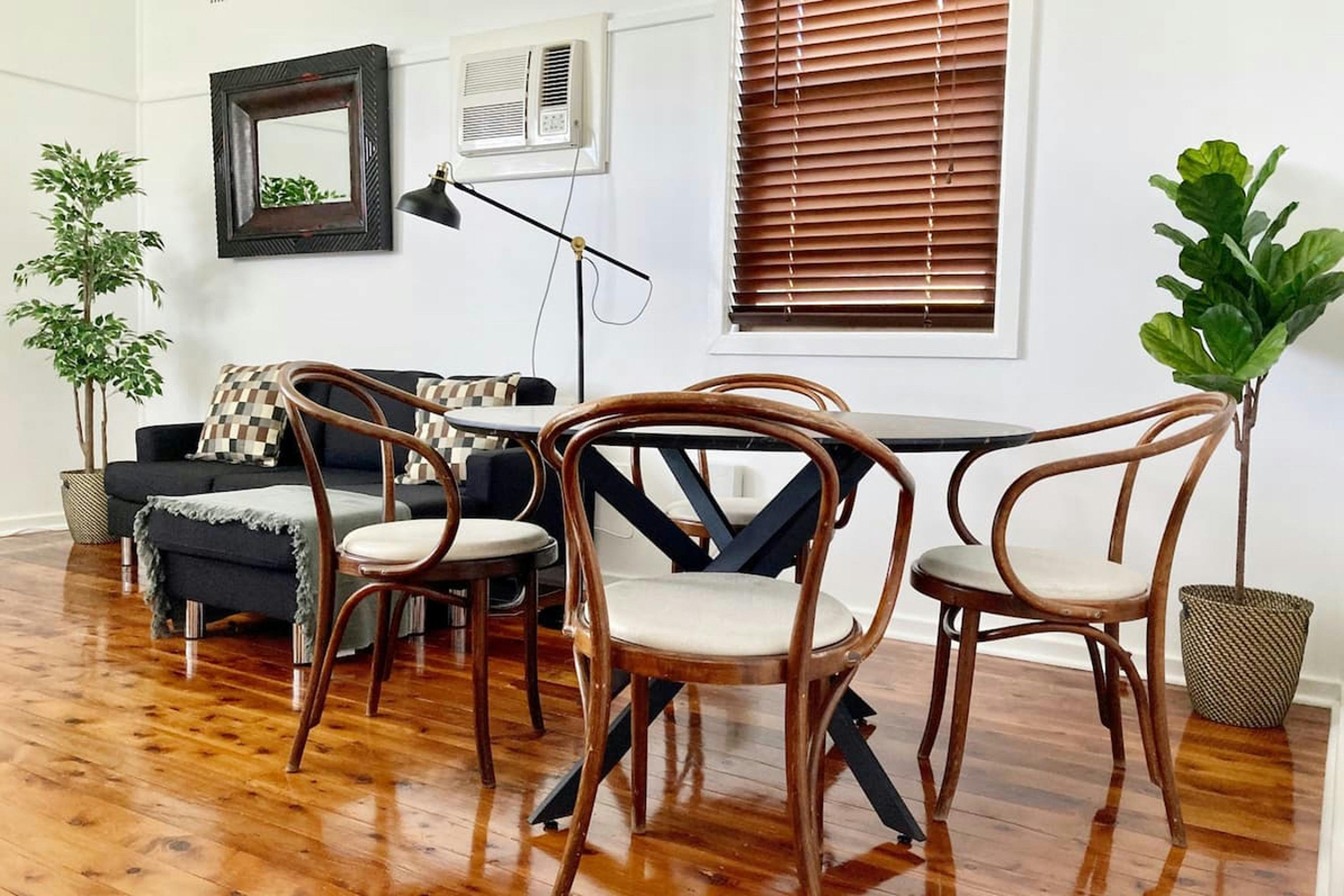 lounge and dining combined with reading lamps and smart TV