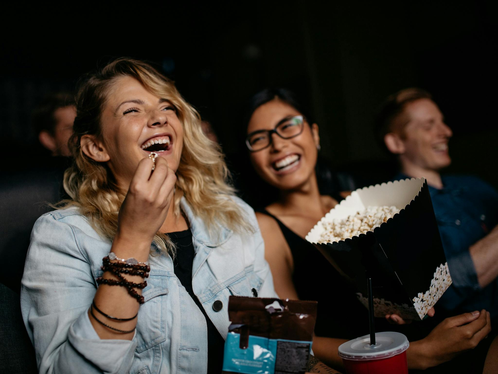 Women laughing in Cinema